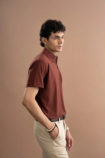 Maroon short-sleeve quarter-zip polo shirt, side view with textured fabric