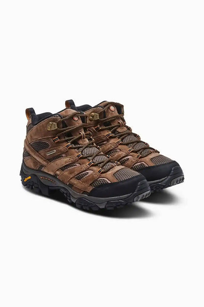 Merrell hiking shoes side angle in brown leather and mesh with chunky rubber sole