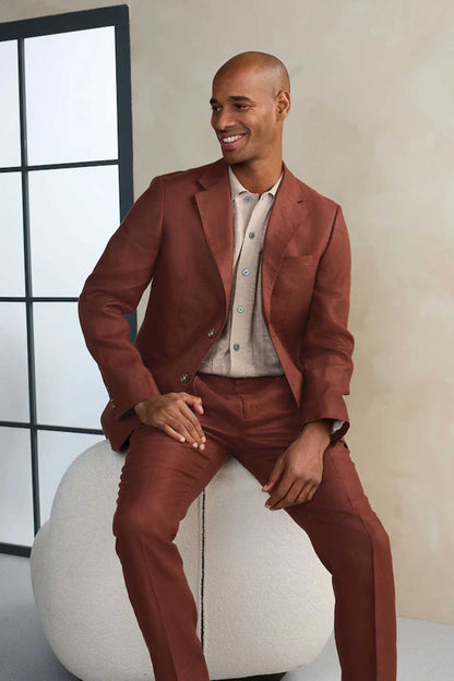 Brown three-piece suit with single-breasted jacket and vest, model seated