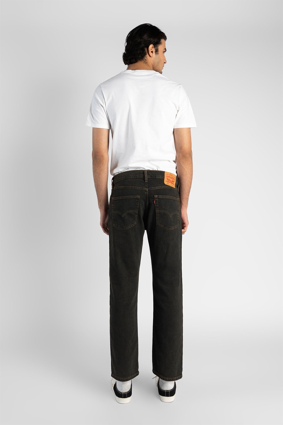 Levi's dark denim jeans with back pockets, straight leg, rear view