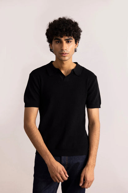 Men's black polo shirt with short sleeves and collar, front pose with hands at sides
