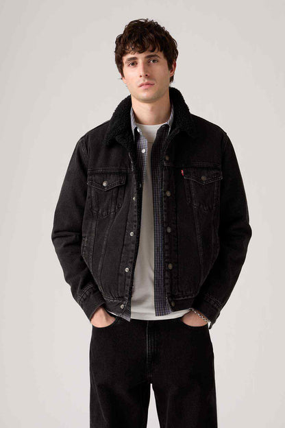 Levi's black denim jacket with button front, flap pockets, and dark lined collar