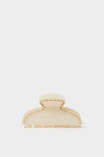 Cream claw clip with oval top and pearl-like bead trim