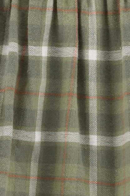 Plaid fabric close-up in olive green, white, and muted orange grid