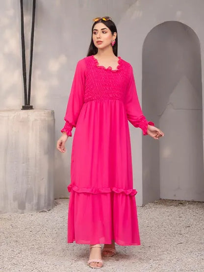 Nazmina hot pink maxi dress with smocked chest, long sleeves, tiered ruffle skirt