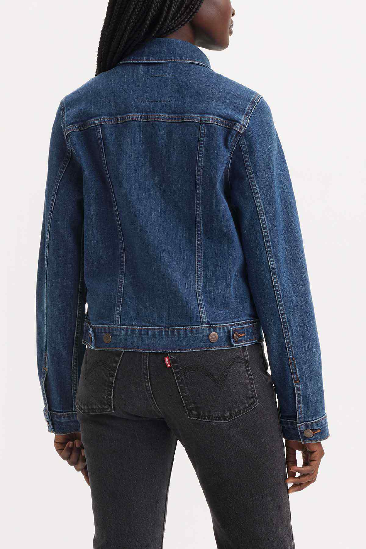 Dark indigo denim jacket back view with buttoned placket and yoke seam, long sleeves