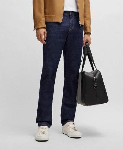 Dark blue fitted jeans with front pockets, belt loops, and cuffed hem