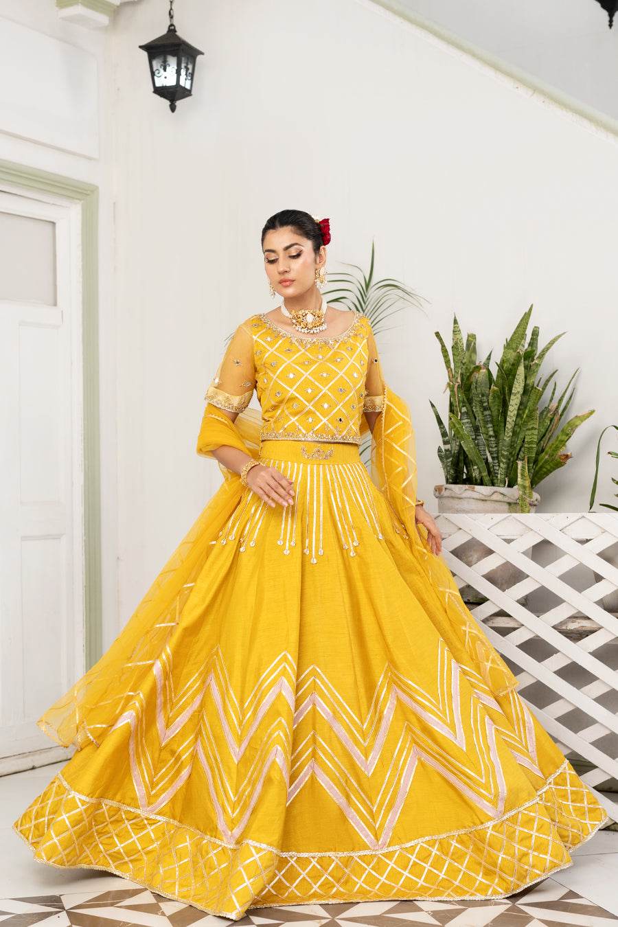 Mustard yellow embroidered long dress with chevron skirt border and tassel details
