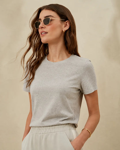 Grey crew-neck short-sleeve t-shirt with white drawstring pants