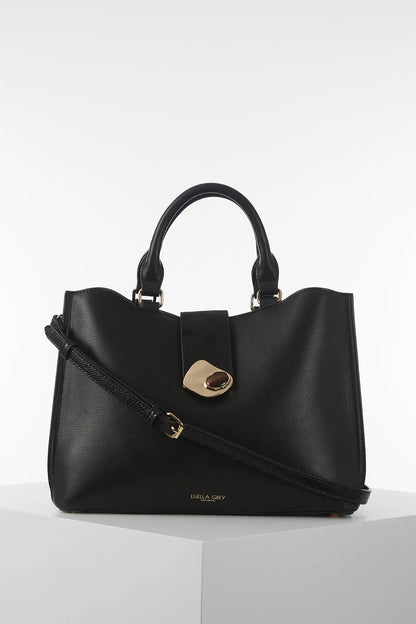 Luella Grey Pakistan black handbag with top handles, front clasp, and shoulder strap