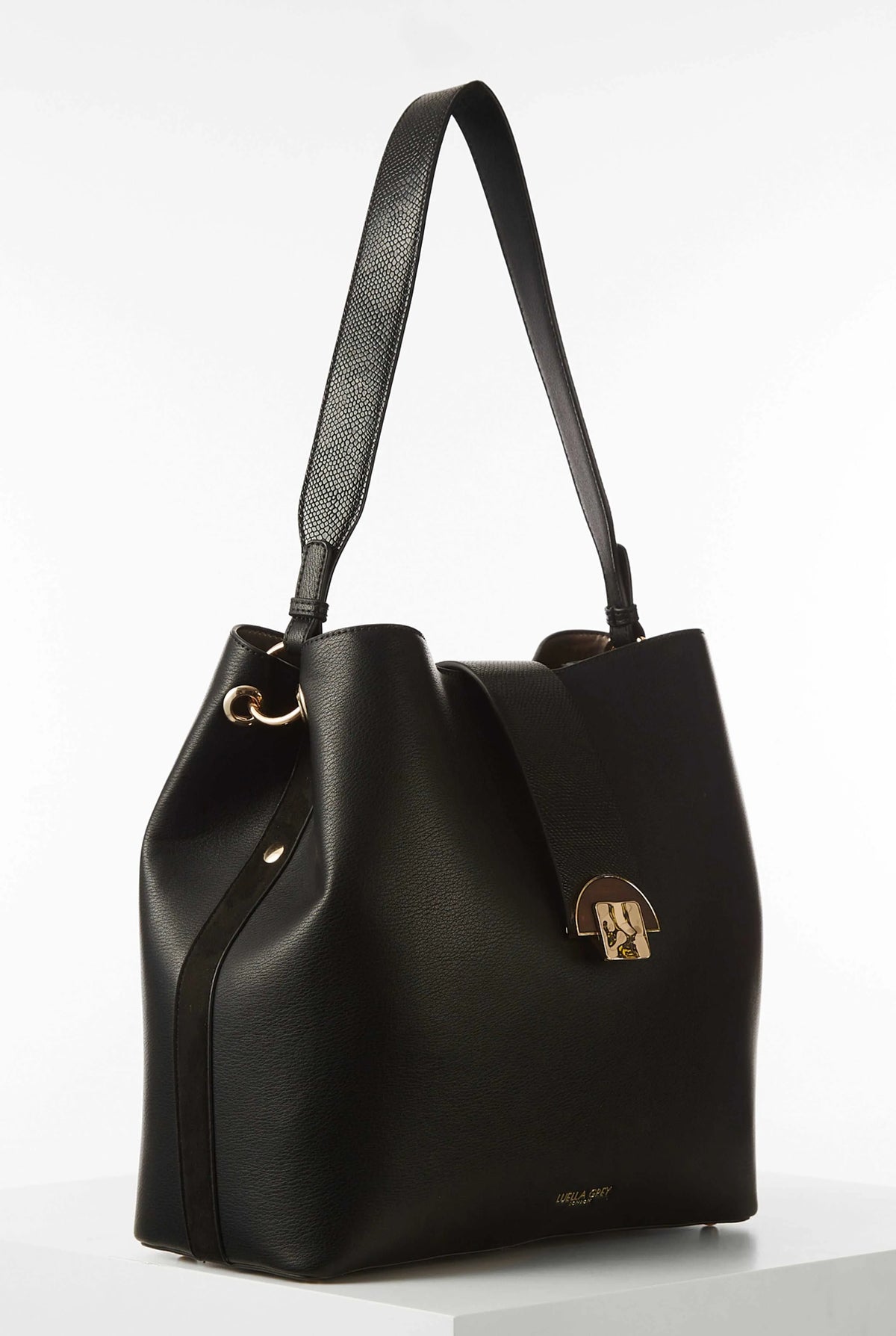 Black hobo shoulder bag with adjustable straps, gold rings, and front emblem