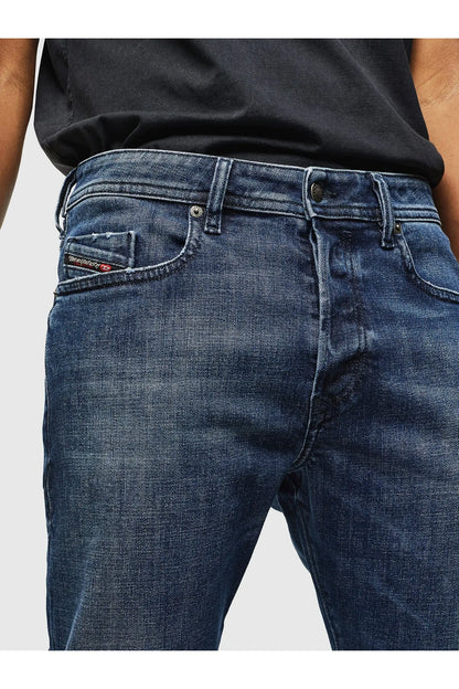 Dark blue denim jeans waist close-up with button, belt loops, and coin pocket