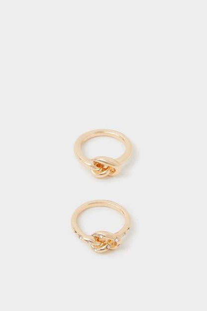 Two gold twisted rings with small clear stones on open bands