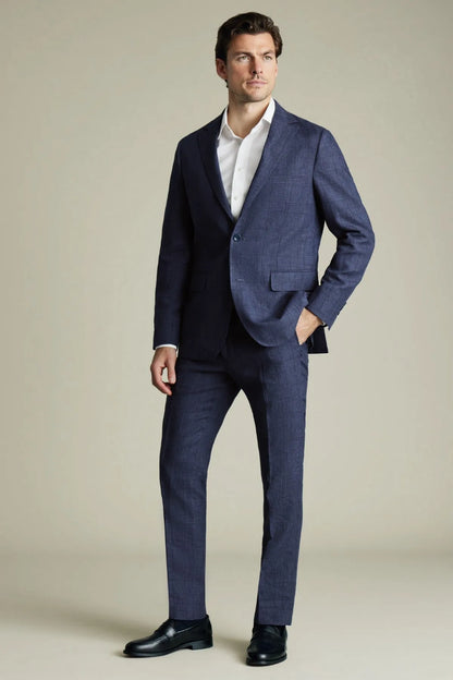 Blue slim-fit dress trousers with belt loops and pressed crease, full-body view
