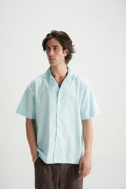 Sky blue short-sleeve button-up shirt, front view with button placket