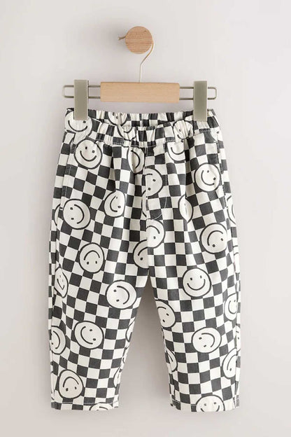 NEXT kids' smiley checker-print trousers on hanger