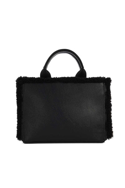 Black rectangular handbag front view with top handles and fuzzy side panels.