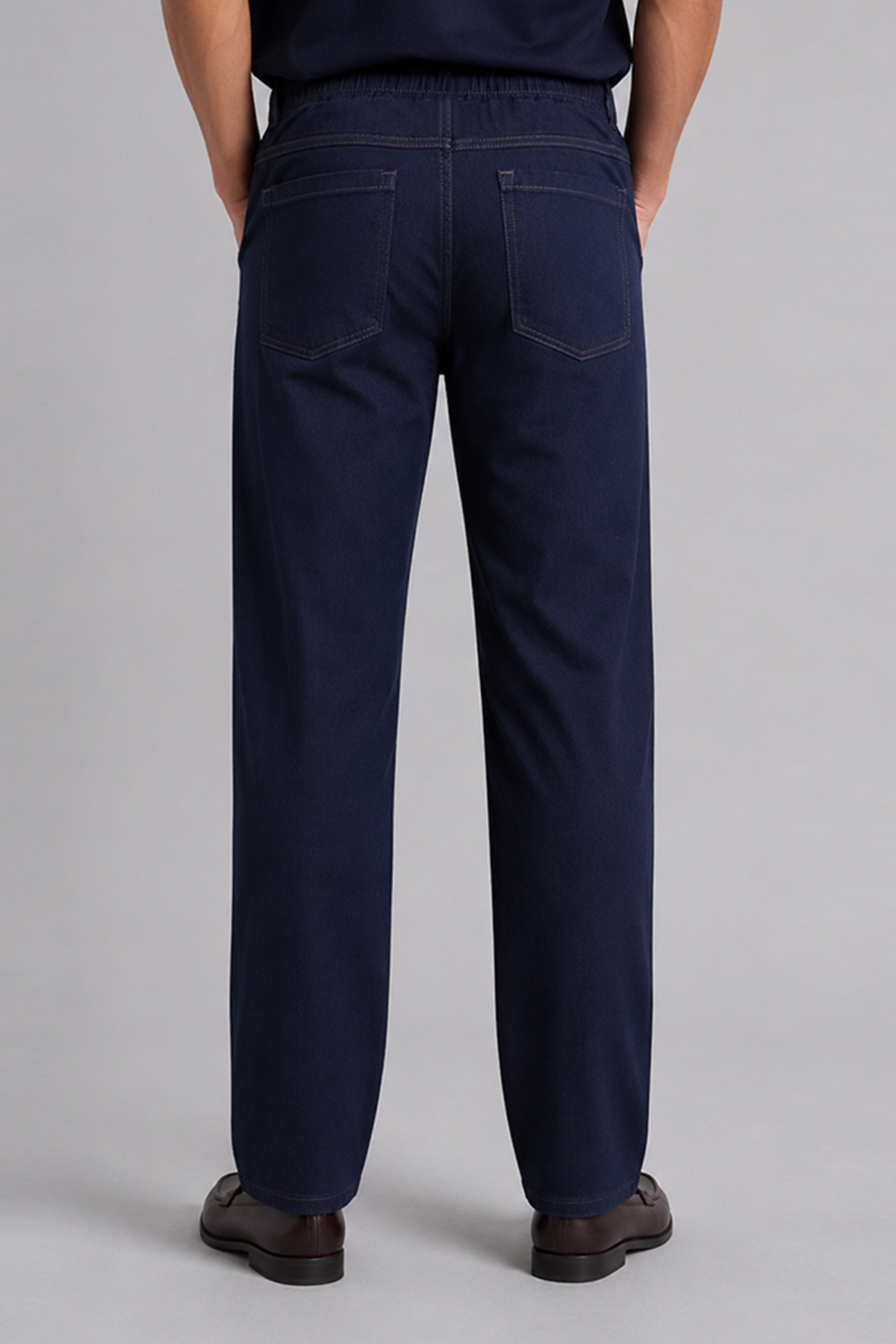 Navy blue straight-leg trousers with front patch pockets and stitched seams