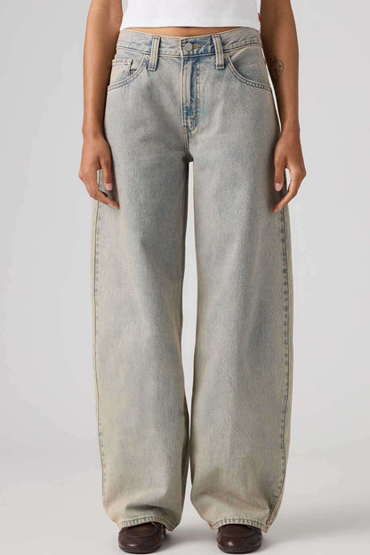 Levi's light gray wide-leg jeans with belt loops and button fly, close-up