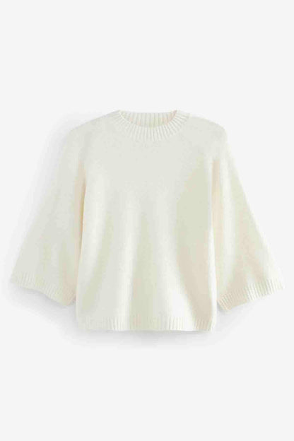 Ecru knit sweater with ribbed round neck and short sleeves