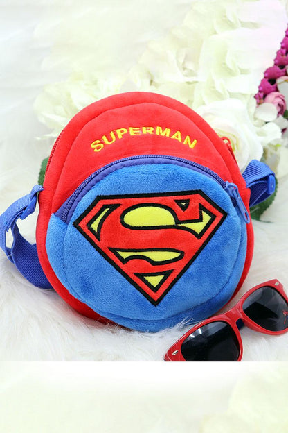 Round plush Superman crossbody pouch in red and blue with front logo and blue strap