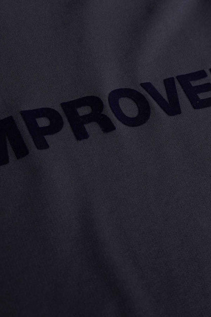 Dark navy sweatshirt fabric with close-up of 'IMPROVED' print