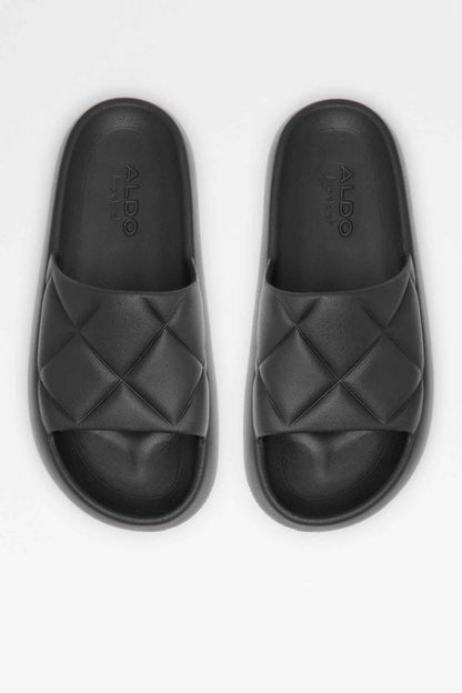 Pair of black slide sandals with diamond-stitch upper and printed footbed logo