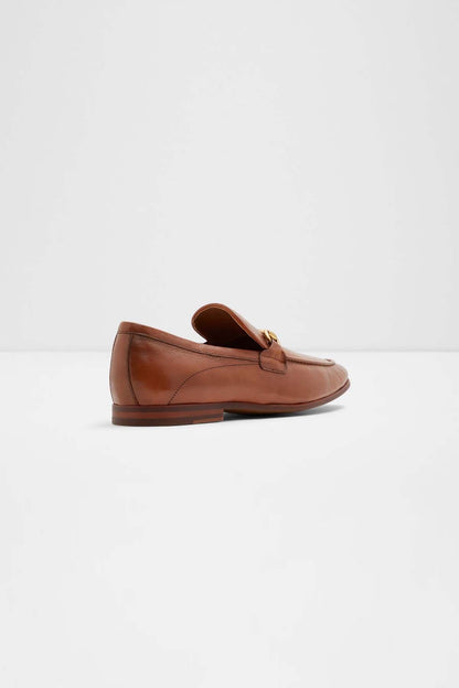 Cognac slip-on loafer with gold bit ornament and low-profile sole