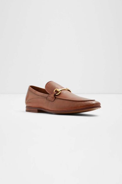 Cognac leather-look loafer with gold-tone buckle hardware and stitched toe