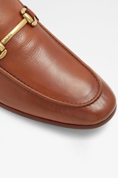 Close-up of cognac loafer vamp with ALDO logo stitching and gold hardware