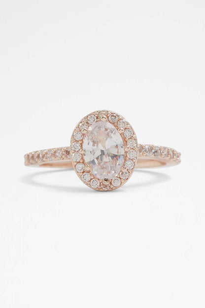 ALDO ring with oval clear center stone and pavé halo in rose gold tone