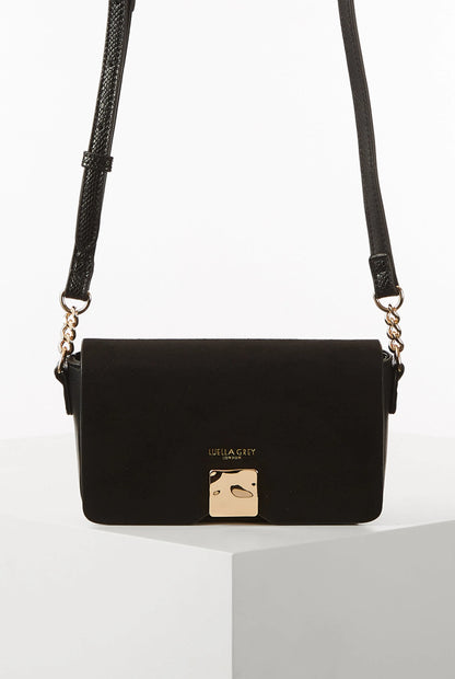 Black flap shoulder bag with gold-tone clasp and adjustable braided strap