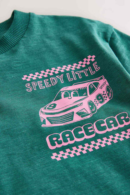 Close-up of teal kids' T-shirt sleeve showing â€œSpeedy Littleâ€ race car graphic