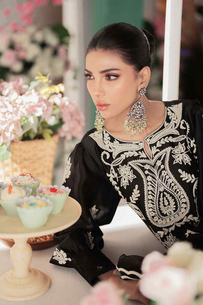 Black embroidered tunic dress with ornate front panel and long sleeves, three-quarter view
