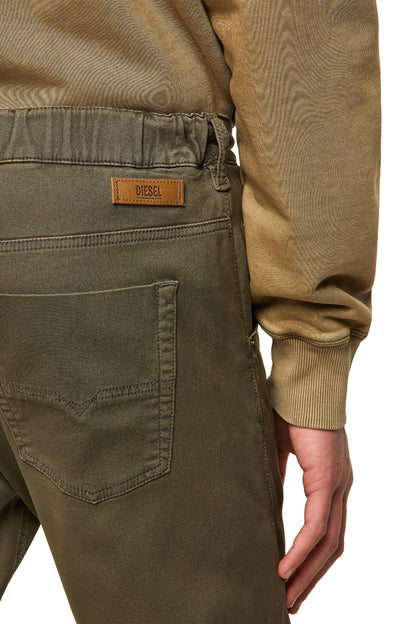 Olive green pants with front patch pockets and orange logo label