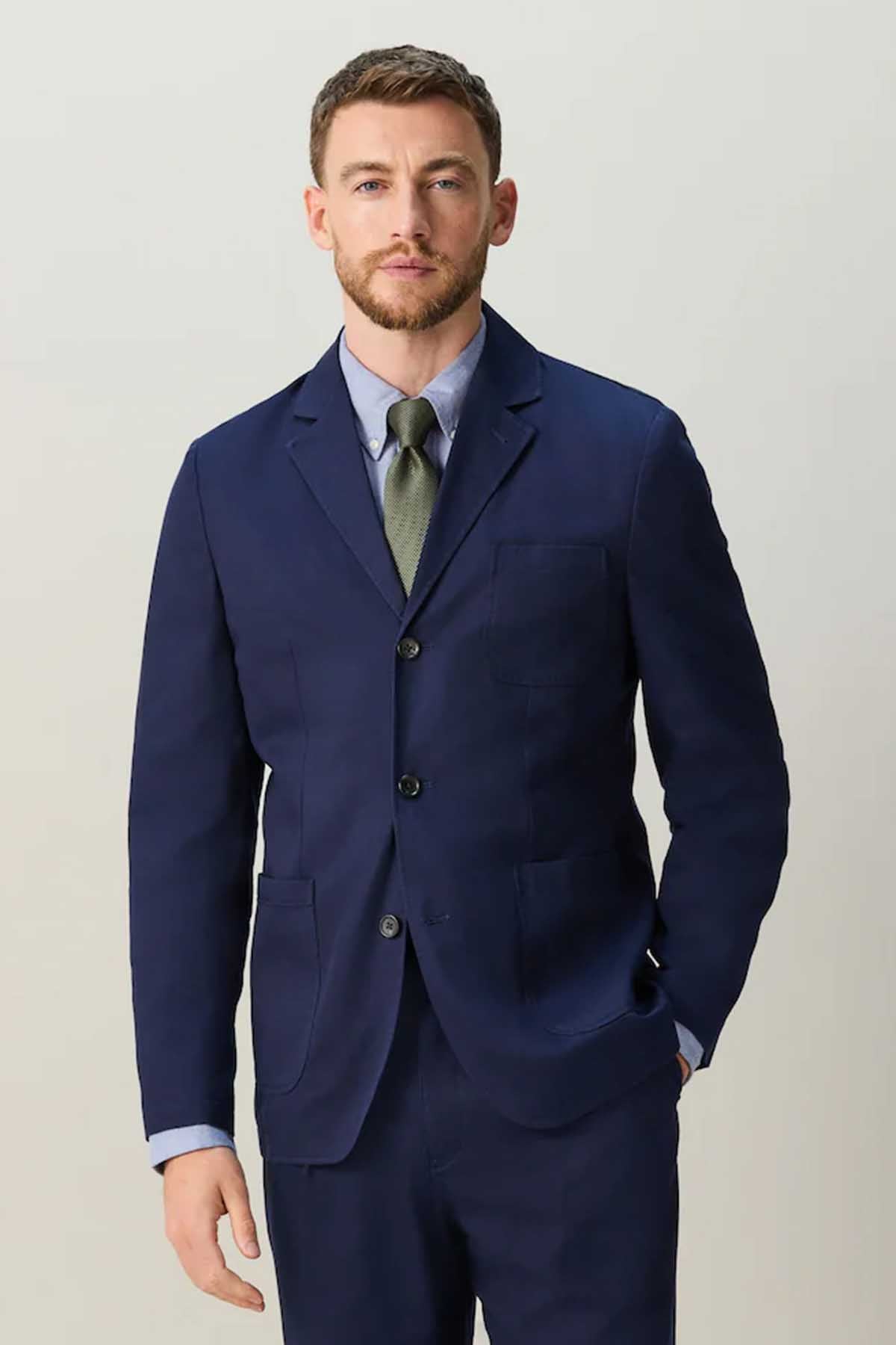 Navy men's suit jacket with notch lapels and two-button front