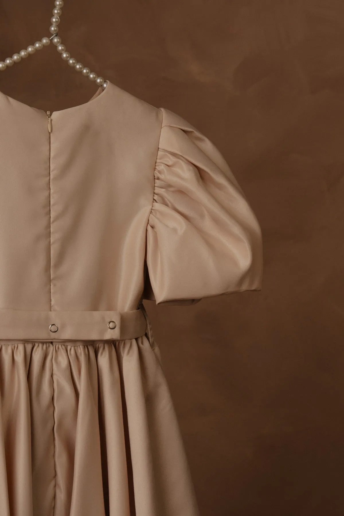 Beige puff sleeve dress with gathered skirt and side ruching near waist