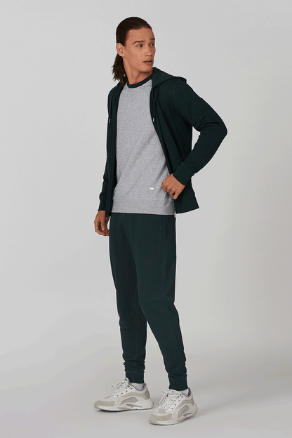 Men's raglan sweatshirt with dark green sleeves and matching joggers, zip jacket worn