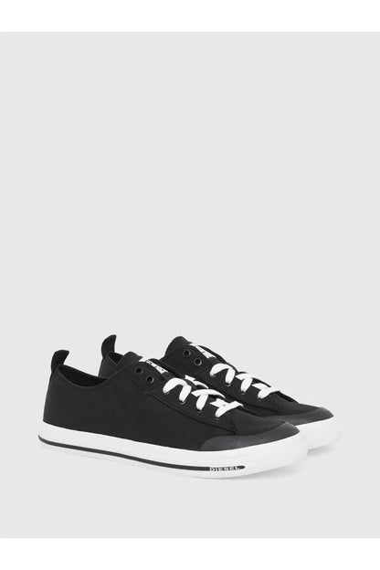 Black low-top lace-up sneakers, side view, white rubber sole