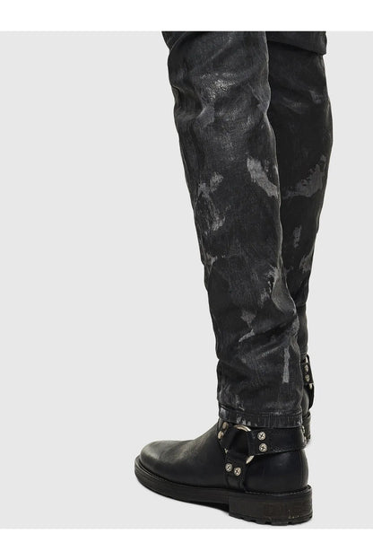 Black distressed jeans with ankle strap and metal buckle detail
