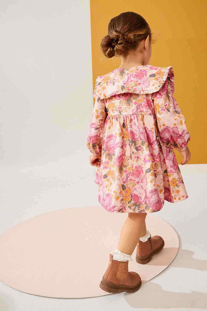 Girls pink floral long-sleeve dress from back, ruffled yoke and gathered skirt