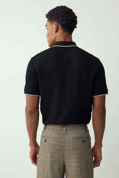 Black short-sleeve polo shirt with contrast collar trim, back view