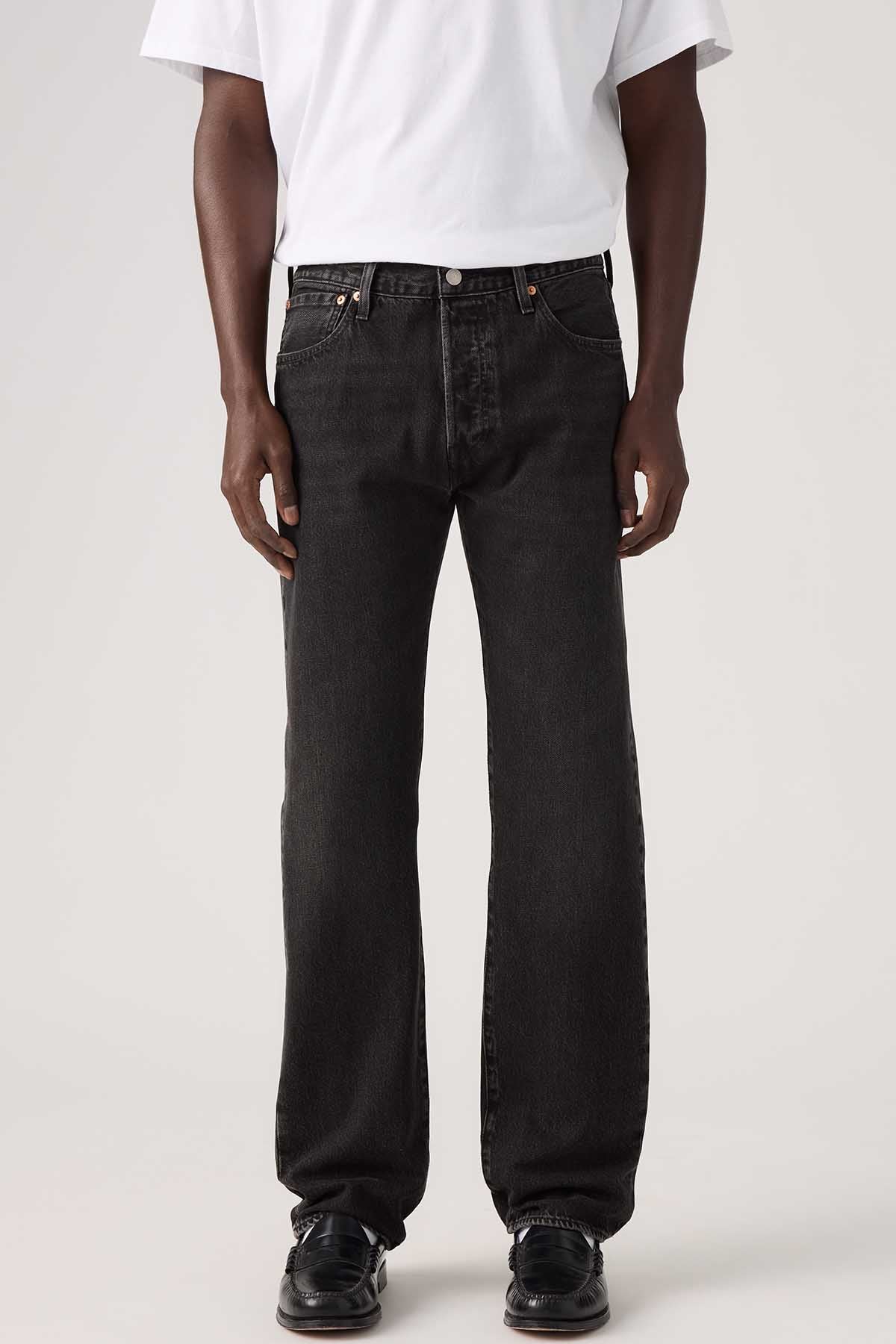 Levi's black straight-leg denim jeans close-up, front button and stitched pockets