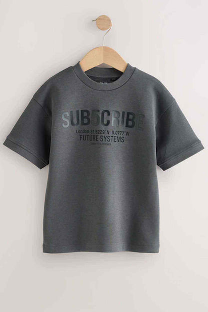 Kids dark grey graphic T-shirt on hanger with 'SUBSCRIBE' front logo