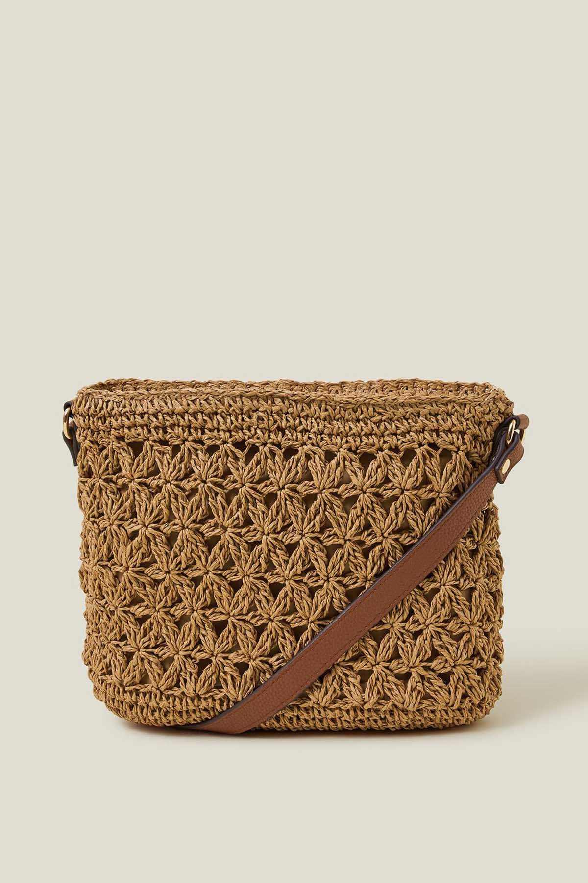 Natural crochet crossbody bag with brown leather strap and zip top