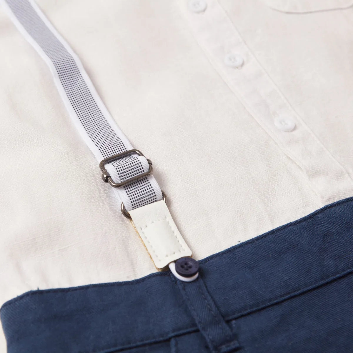 Navy suspender clips with white webbing and button closure