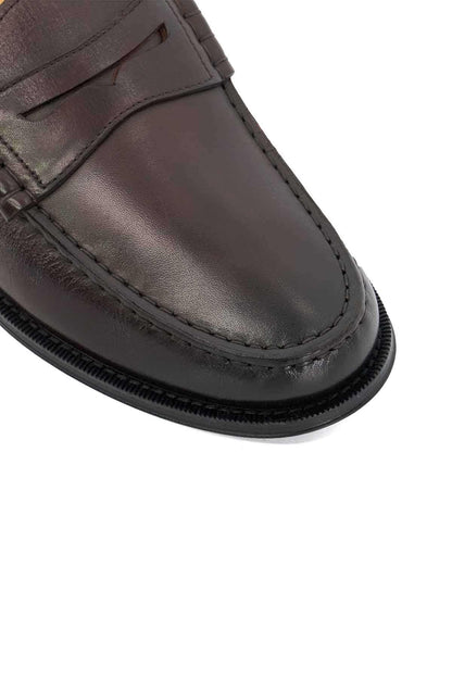 Brown leather loafer with stitched vamp and black gripped sole