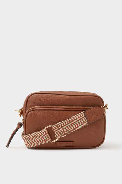 Tan leather-look crossbody bag with top zip closure and woven strap detail