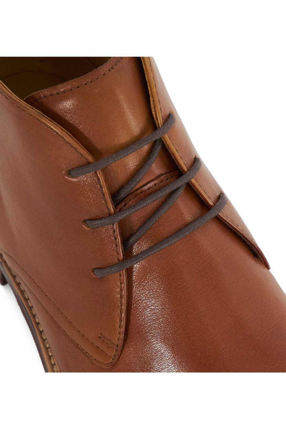 Brown leather lace-up ankle boot upper with seam stitching and eyelets