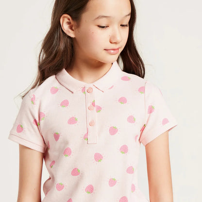 Kids pink strawberry print polo shirt close-up with buttoned placket and collar